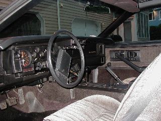 [Camaro interior and dashboard from inside driver door]